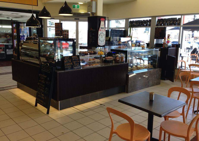 Prego Espresso Bar interior — counter, display cases and dining area